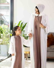 Elegant matching two-piece abaya dress set with contrast piping detail, available at our online abaya shop.