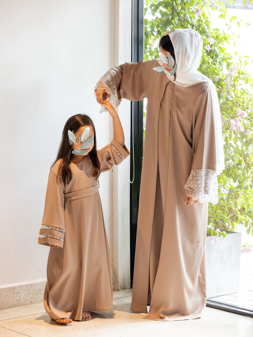 Elegant abaya dresses with lace sleeves from our latest abaya designs collection.