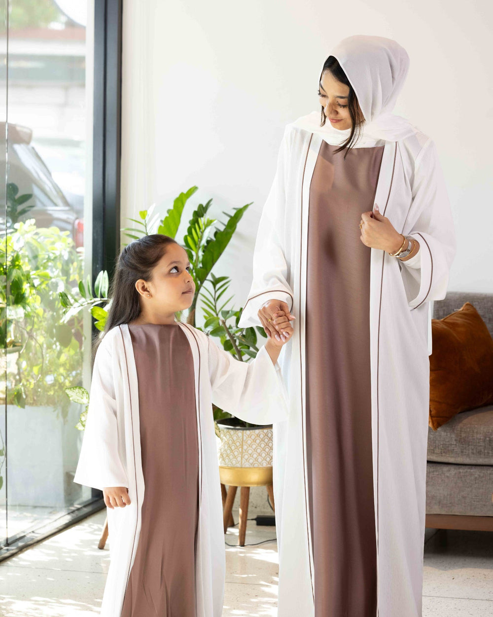 Elegant matching two-piece abaya dress set with contrast piping detail, available at our online abaya shop.