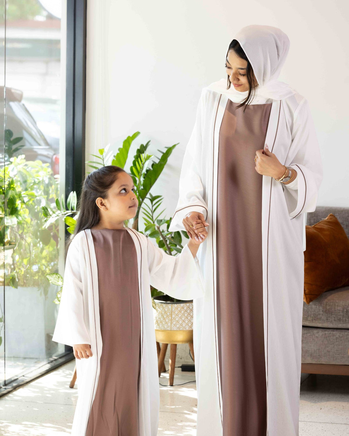 Elegant matching two-piece abaya dress set with contrast piping detail, available at our online abaya shop.